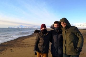 Three students on the beach