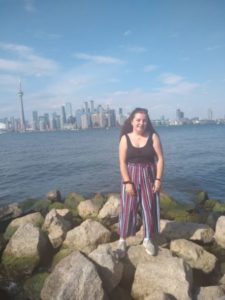 Maiya standing on the shore of Lake Ontario, Toronto