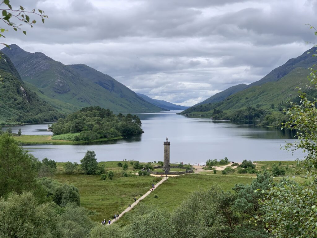 Landscape view of Glenfinnan Monument and the lake and mountains in the distance