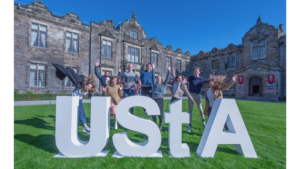 Students with University of St Andrews sign in St Salvator's Quadrangle