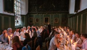 Candlelit dinner with two tables, wood pannelled room