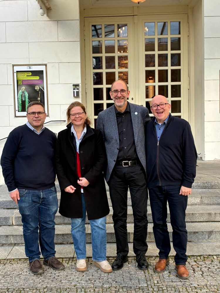 Four Bonn and St Andrews researchers outside a building